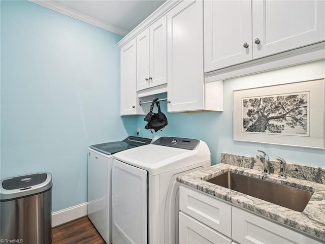 1659 Angus Ridge Dr, Kernersville, NC 27284 - washroom with cabinet space, independent washer and dryer, dark wood-style flooring, crown molding, and baseboards