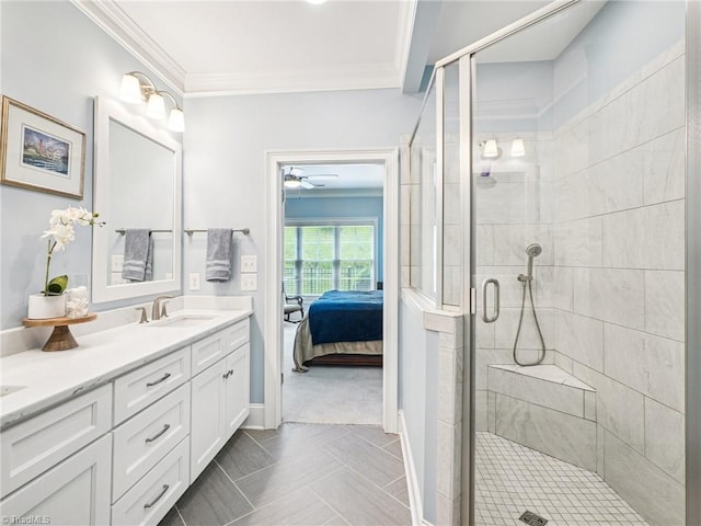 1659 Angus Ridge Dr, Kernersville, NC 27284 - bathroom with double vanity, crown molding, a stall shower, connected bathroom, and a ceiling fan