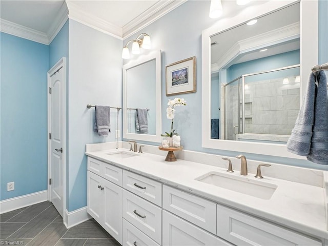 1659 Angus Ridge Dr, Kernersville, NC 27284 - bathroom featuring double vanity, a shower stall, crown molding, and baseboards