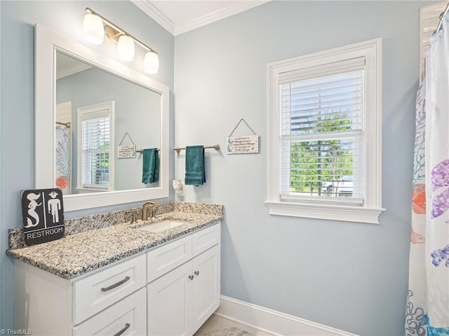 1659 Angus Ridge Dr, Kernersville, NC 27284 - bathroom with vanity, crown molding, healthy amount of natural light, and baseboards