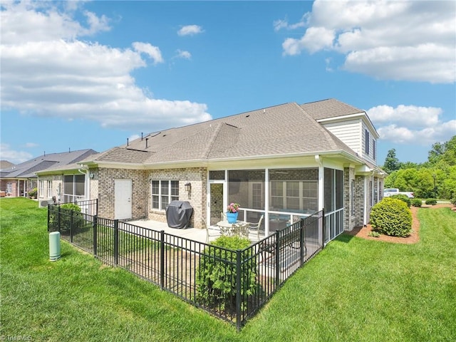 1659 Angus Ridge Dr, Kernersville, NC 27284 - rear view of property featuring a patio, roof with shingles, brick siding, and a sunroom