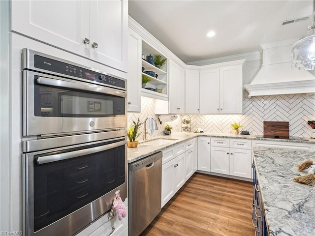 1659 Angus Ridge Dr, Kernersville, NC 27284 - kitchen with stainless steel appliances, a sink, white cabinetry, decorative backsplash, and recessed lighting
