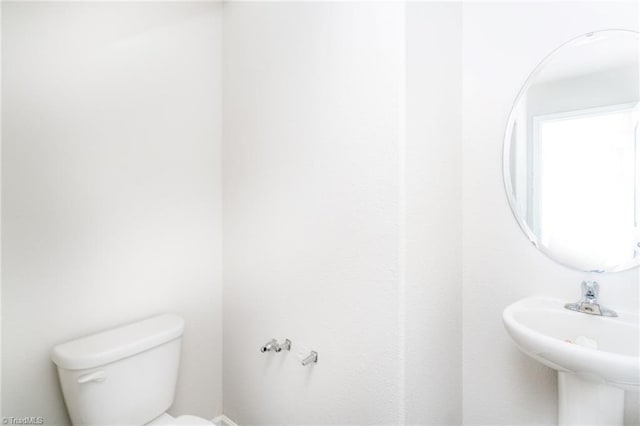 bathroom with sink and toilet