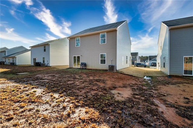 rear view of house featuring a patio area and central air condition unit