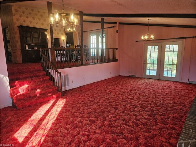 112 Balcony Ln, Mount Airy, NC 27030 - unfurnished living room with lofted ceiling with beams and an inviting chandelier