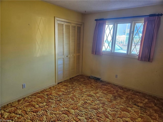 112 Balcony Ln, Mount Airy, NC 27030 - unfurnished bedroom featuring a closet, carpet, and a textured ceiling