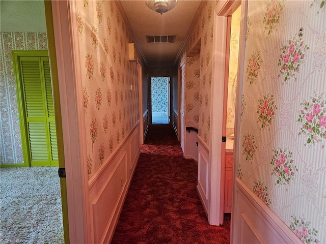 112 Balcony Ln, Mount Airy, NC 27030 - corridor featuring dark colored carpet and a textured ceiling