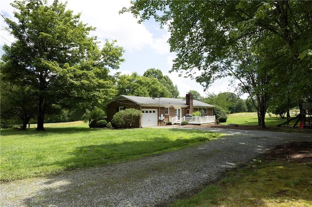 4345 Mcintyre Rd, Gibsonville, NC 27249 - view of front of home featuring driveway, a chimney, a garage, a front lawn, and covered porch