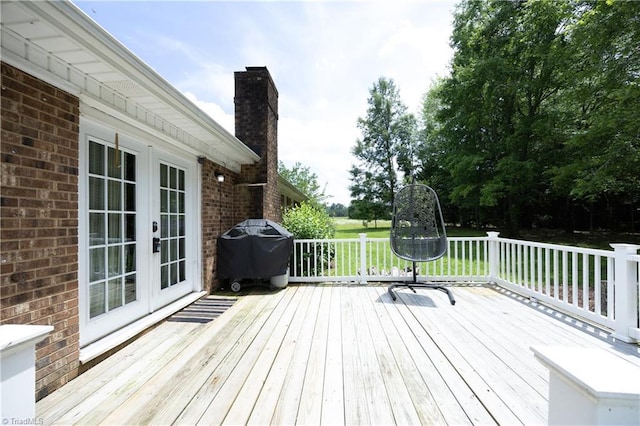 4345 Mcintyre Rd, Gibsonville, NC 27249 - wooden terrace with french doors and grilling area