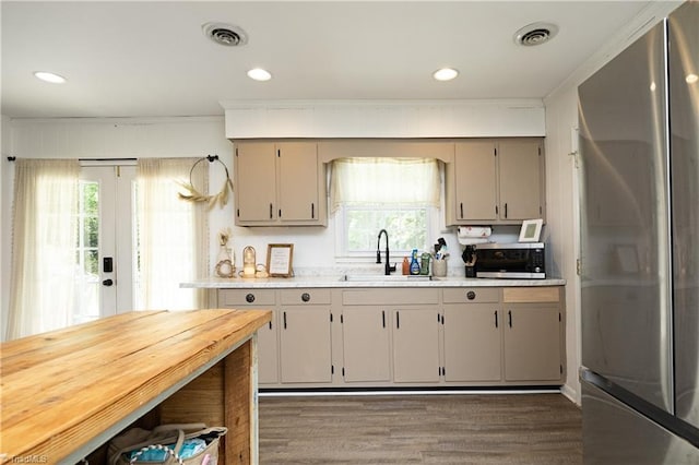 4345 Mcintyre Rd, Gibsonville, NC 27249 - kitchen with appliances with stainless steel finishes, wood finished floors, crown molding, recessed lighting, and gray cabinetry