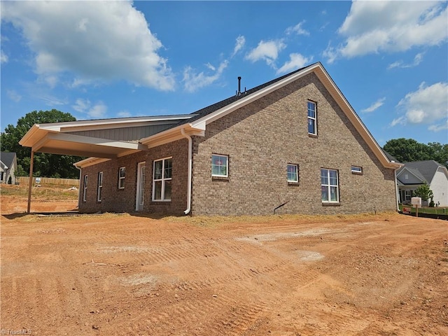 view of property exterior featuring brick siding