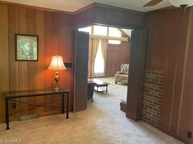 327 Lanier Dr, Lexington, NC 27295 - hall featuring carpet floors and wood walls