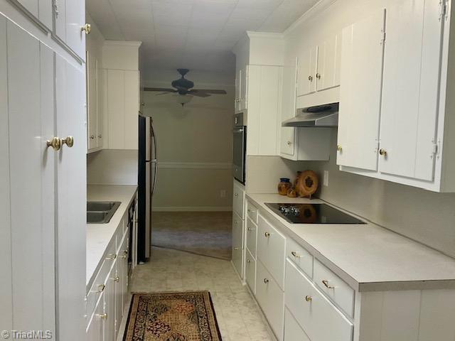327 Lanier Dr, Lexington, NC 27295 - kitchen featuring black appliances, ceiling fan, under cabinet range hood, white cabinets, and light countertops