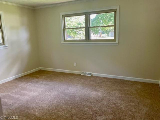 327 Lanier Dr, Lexington, NC 27295 - empty room featuring carpet floors, ornamental molding, and baseboards
