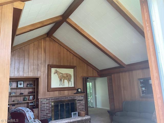 327 Lanier Dr, Lexington, NC 27295 - living area featuring wooden walls, a brick fireplace, and carpet floors