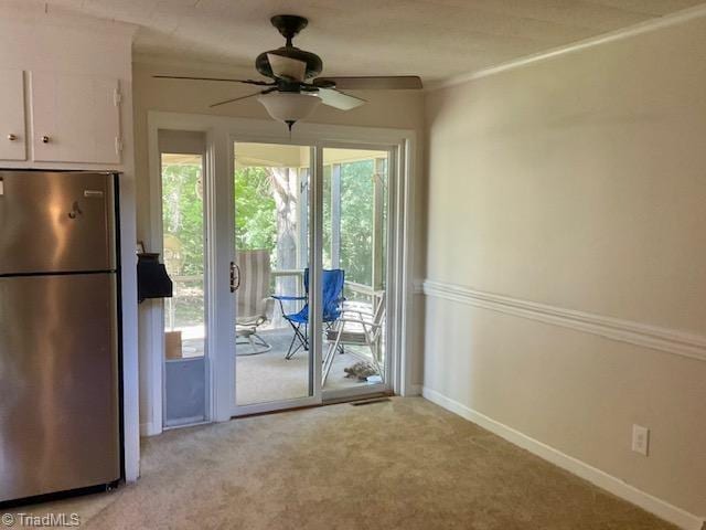 327 Lanier Dr, Lexington, NC 27295 - entryway featuring a ceiling fan, light carpet, and baseboards
