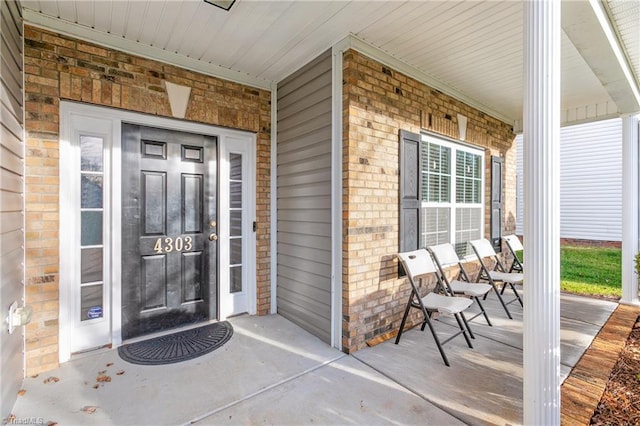 doorway to property with covered porch