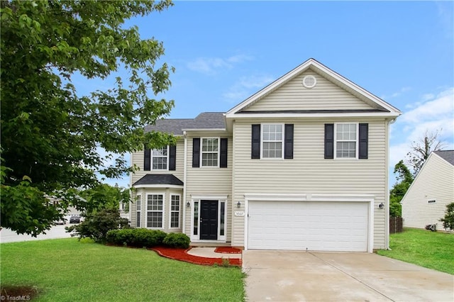 view of front facade with a front yard and a garage