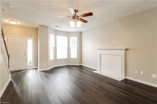 entrance foyer with ceiling fan and dark hardwood / wood-style floors