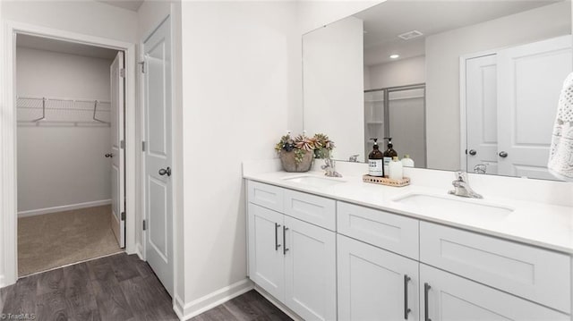 bathroom with vanity and wood-type flooring