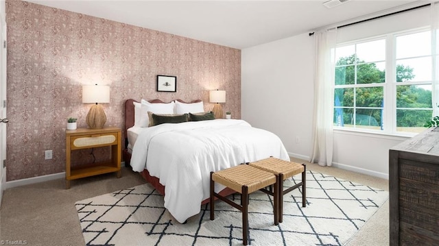 bedroom with light colored carpet