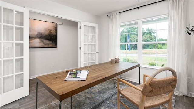 office with dark hardwood / wood-style flooring and french doors