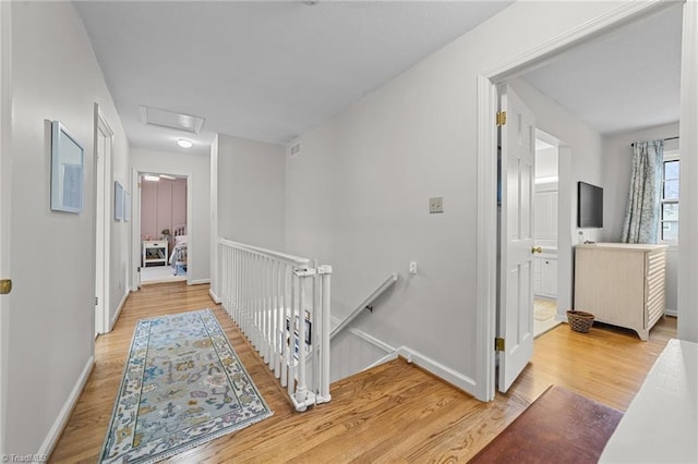 corridor featuring light hardwood / wood-style flooring