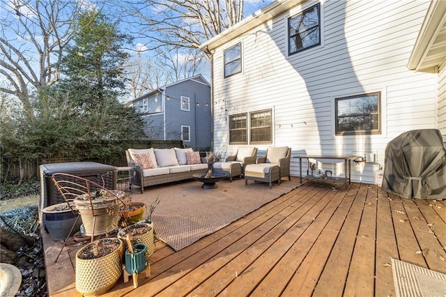 deck featuring a grill and outdoor lounge area