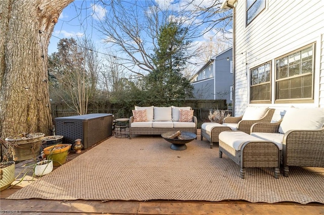 view of patio featuring an outdoor living space with a fire pit