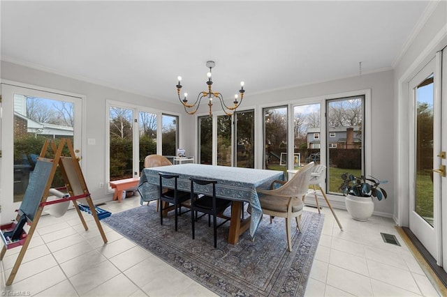 sunroom featuring a notable chandelier