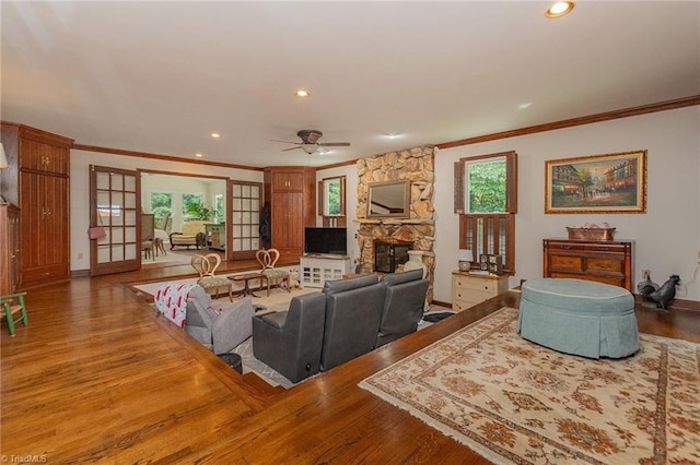250 Oakmont Ter, Lexington, NC 27295 - living room with crown molding, a stone fireplace, recessed lighting, wood finished floors, and a ceiling fan
