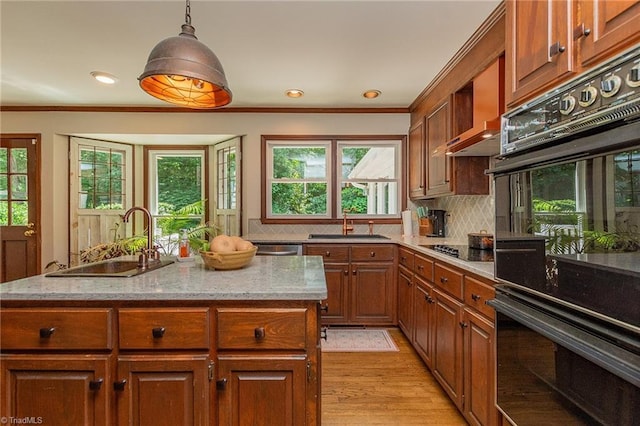 250 Oakmont Ter, Lexington, NC 27295 - kitchen with decorative backsplash, light wood-style flooring, ornamental molding, brown cabinets, and light stone countertops