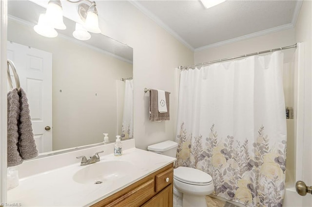 full bathroom featuring vanity, crown molding, and toilet