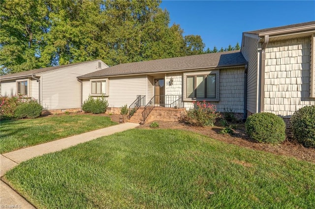 single story home with a front lawn