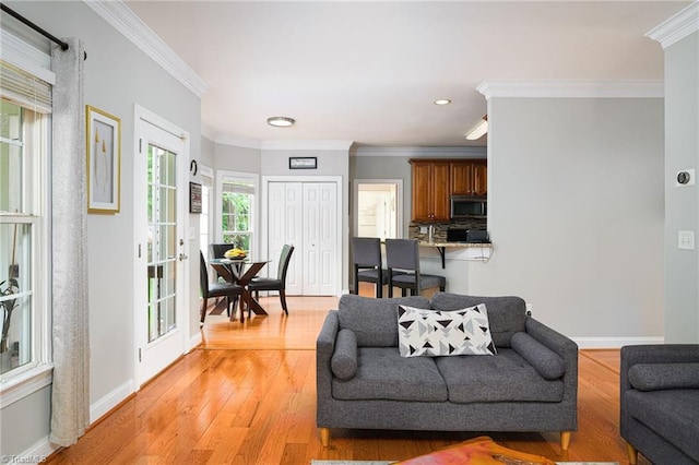 15 Orchard Grass Ct, Greensboro, NC 27410 - living room featuring light wood-style floors, crown molding, baseboards, and recessed lighting