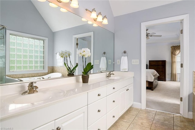 15 Orchard Grass Ct, Greensboro, NC 27410 - full bath featuring vaulted ceiling, connected bathroom, double vanity, plenty of natural light, and tile patterned floors
