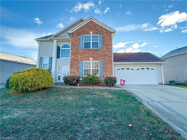 front of property with a front yard and a garage