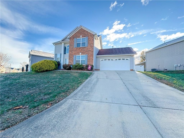 view of property featuring a front lawn and a garage