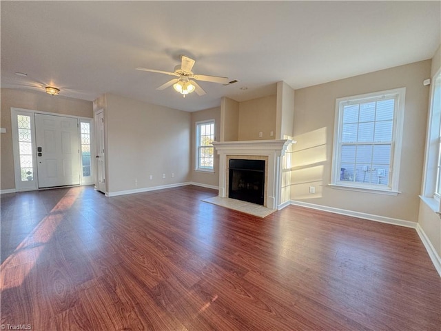 unfurnished living room with hardwood / wood-style floors and ceiling fan