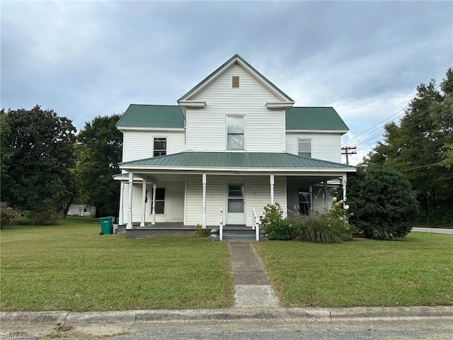 farmhouse-style home with a porch and a front lawn