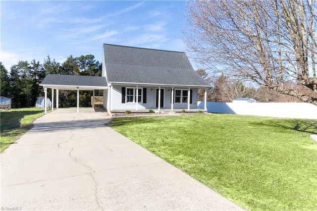 view of front facade with an attached carport, driveway, covered porch, a shingled roof, and a front lawn