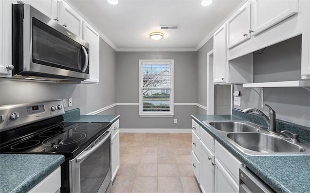 kitchen with visible vents, ornamental molding, a sink, appliances with stainless steel finishes, and white cabinets