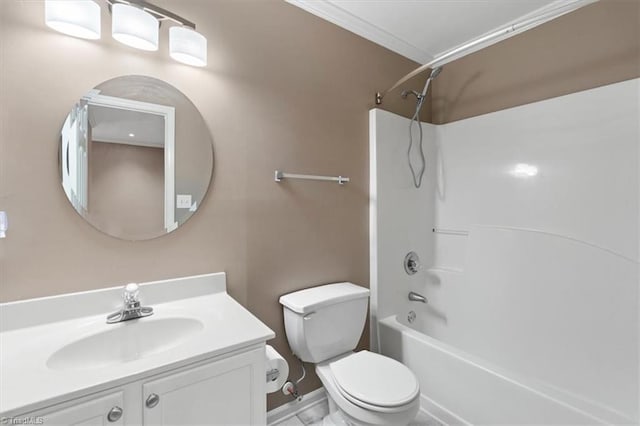 full bathroom featuring bathing tub / shower combination, toilet, ornamental molding, and vanity