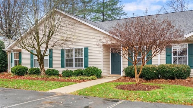 view of front of home featuring uncovered parking