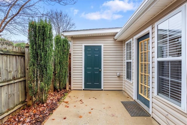 entrance to property featuring a patio