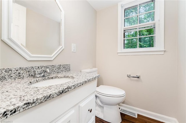1 Red Fern Ct, Greensboro, NC 27455 - bathroom with vanity, toilet, baseboards, and wood finished floors