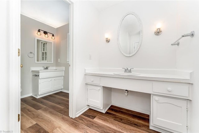 1 Red Fern Ct, Greensboro, NC 27455 - bathroom featuring wood finished floors, two vanities, and baseboards