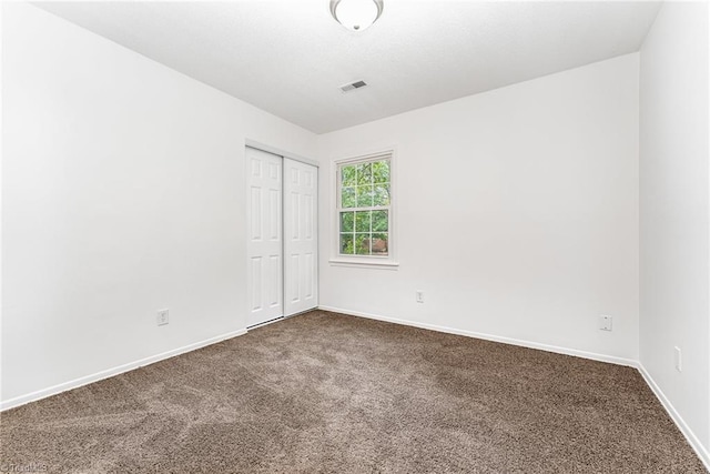 1 Red Fern Ct, Greensboro, NC 27455 - empty room featuring dark carpet and baseboards
