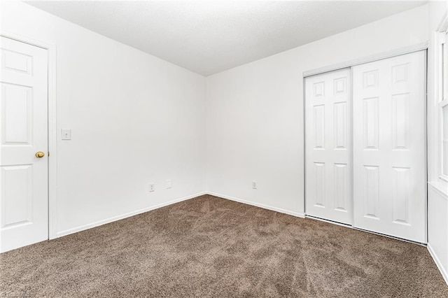 1 Red Fern Ct, Greensboro, NC 27455 - unfurnished bedroom featuring carpet, baseboards, and a closet
