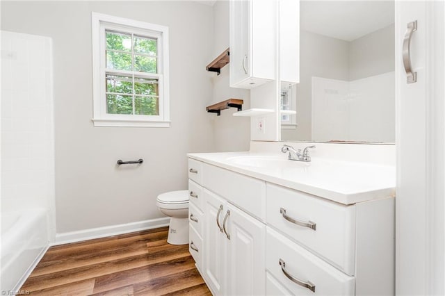 1 Red Fern Ct, Greensboro, NC 27455 - bathroom with vanity, toilet, wood finished floors, baseboards, and bathing tub / shower combination